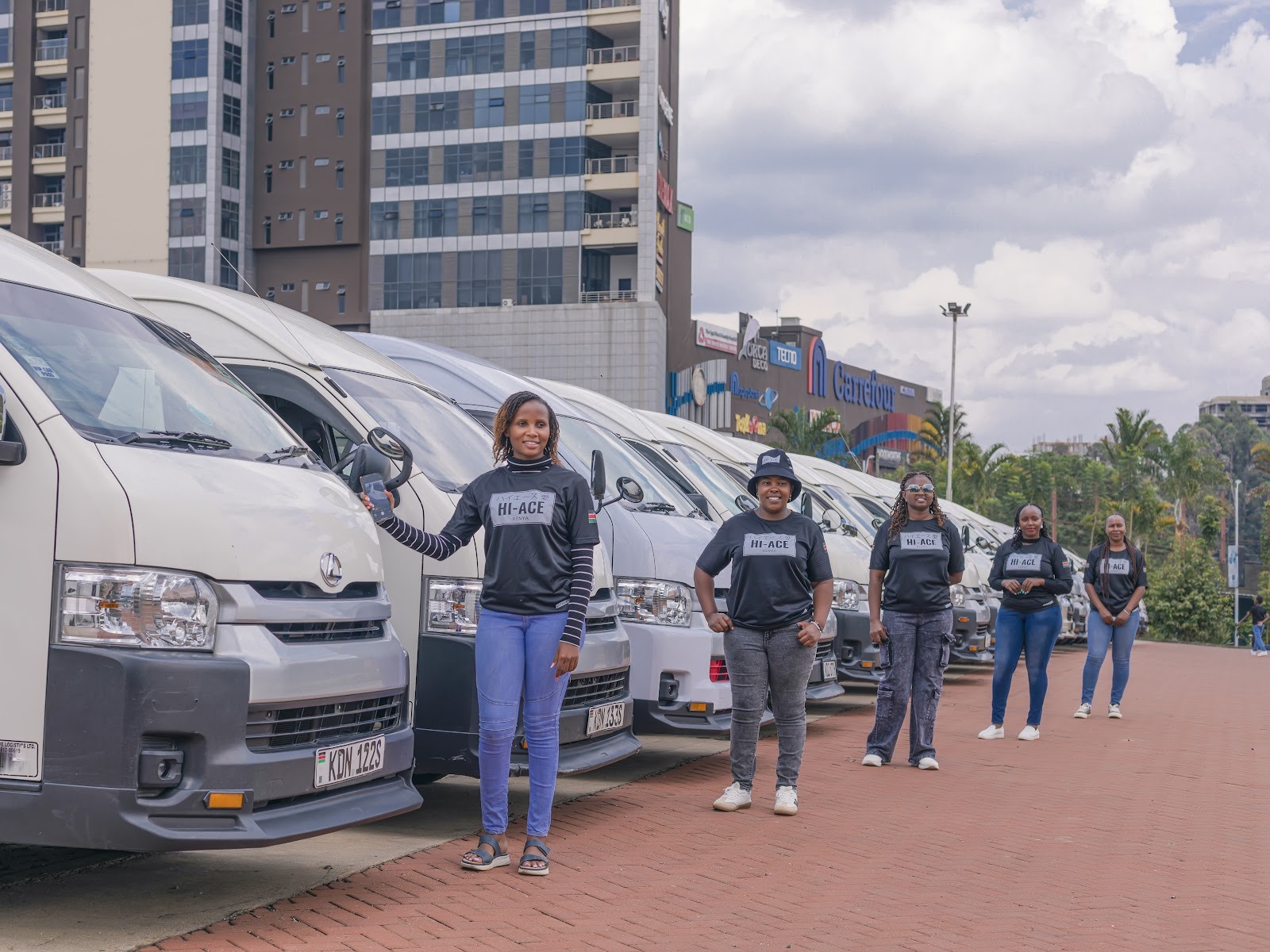 Scar Travels operations team standing with the executive vehicle fleet