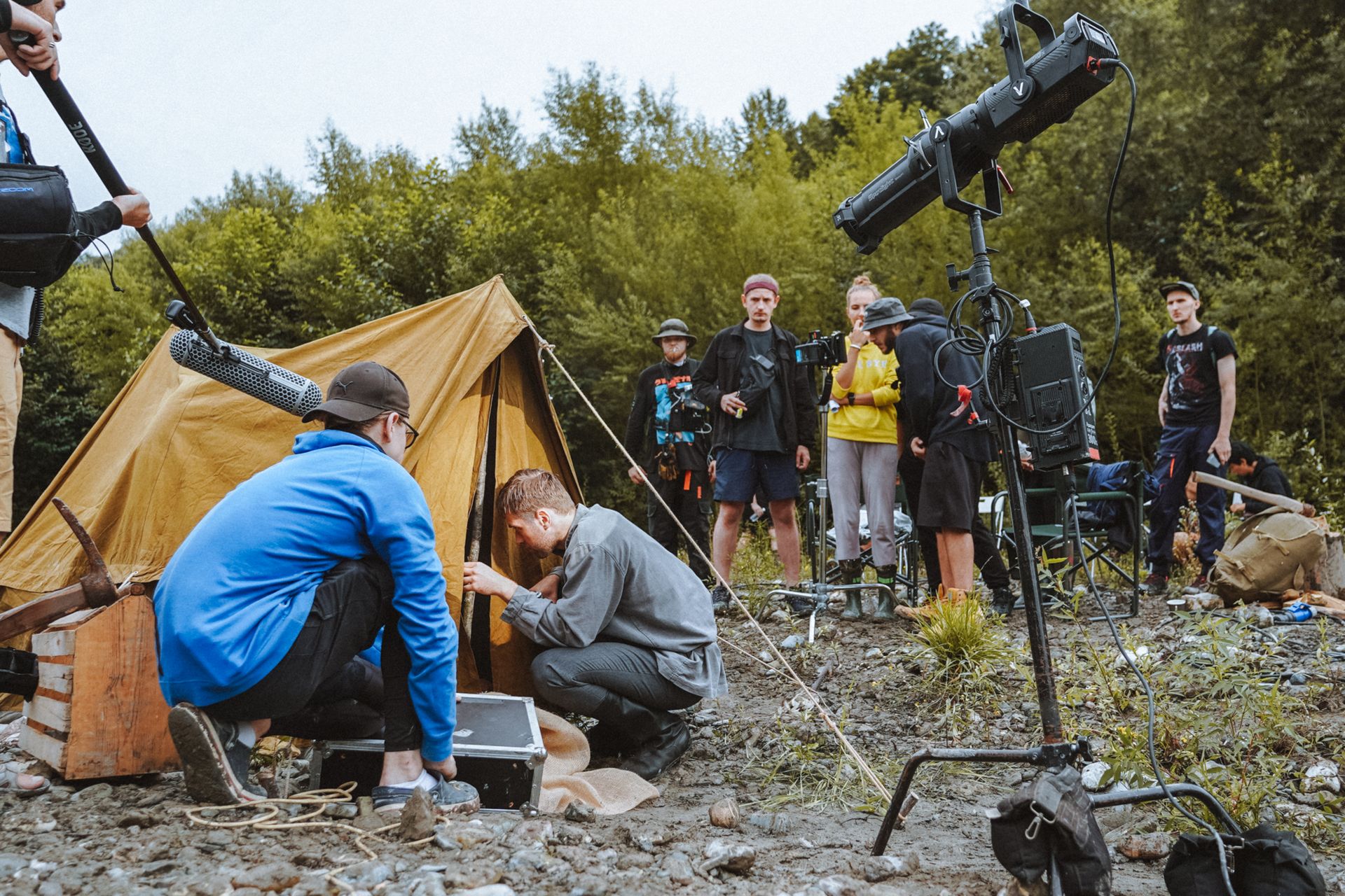 Production crew working around lighting and location equipment